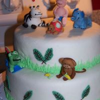 Baby Shower Safari WASC cake covered in white mmf. Baby and all animals made of mmf. Made to match baby's nursery.