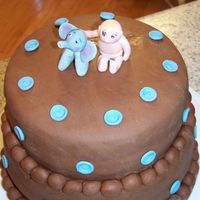 Baby Boy W/elephant WASC cake with chocolate fondant made for a friends baby shower. Baby boy & elephant and buttons made of fondant.