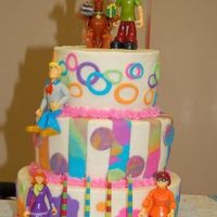 Sixties Scooby Doo Birthday cake iced in buttercream with mmf accents. Scooby Doo characters are plastic toys. There's no way I would try to make fondant...