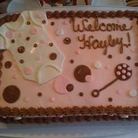 Pink And Brown Polk-A-Dots Iced in buttercream with marshmallow fondant accents.