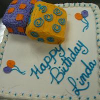 Birthday Presents For Linda Golden butter cake with apricot filling and buttercream icing. The "presents" are all cake as well.