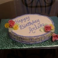 Arlene's Birthday Cake From 2005 Golden butter cake with buttercream filling and icing and gumpaste flowers - my first attempt.