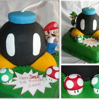 Mario Bros. Bomb! Vanilla cake with buttercream and fondant accents (Action figures are the only non-edibles)