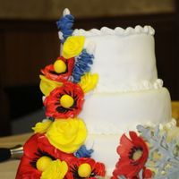 Texas/poland Flowers Flowers made of colored fondant except for the poppies (sprayed with color mist). Donated to a gala celebrating a sister city partnership...