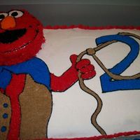 Western Elmo 12X18 sheet cake with 6" round cake as Elmo's head (for two year-old's personal cake).