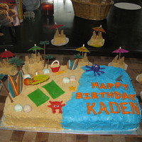 Surfin Birthday Cake This is for my BF's son's surfin beach party. The sand is graham cracker crumbs BC icing. Fondont items except for trees. The...