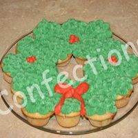 Christmas Wreath This was just a fun dessert I threw together for Christmas dinner. Mini confetti cupcakes with buttercream frosting.