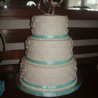 Rachel's Wedding 10, 8, 6" rounds...lemon cake with lemon mousse and boysenberry filling and Italian meringue buttercream. Not the original design i...