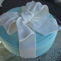 Kathy's Cake WASC with lemon and boysenberry filling and white chocolate bc. My first attempt at a fondant bow.