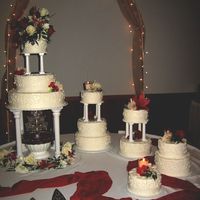 Wedding Cakes This set up is from Wilton ... but I changed the pattern. Scrollwork done with a tip#5. All buttercream with fresh flowers and candles. (If...