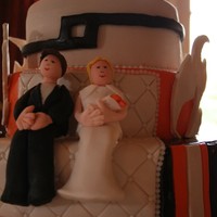 L&l Vanilla, Chocolate and Lemon cake.Top tier is their wedding ring design and the 'flames' are copied from the invitation.