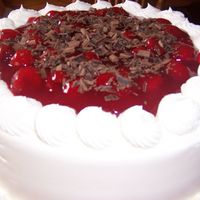 Cherries And Chocolate I made this for my Dad, it was great! Whipped cream frosting, chocolate fudge cake, cherry filling and chocolate shavings on top. Mmmmmm...