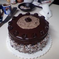 German Chocolate Cake This is a german chocolate cake, but with the frosting on the inside...and poured ganache on the outside.