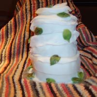 Bandaged Cake fruit cake marzipan coated and wrapped in sugarpaste bandage with marzipan falling autumn leaves