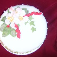 Roses Sugarpaste christmas roses on rolled fondant covered fruit cake
