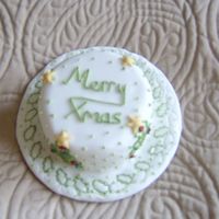Mini Christmas Cake Outlining skills using a holly leaf and tree pastry cutters as patterns