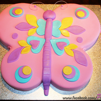 Butterfly Birthday Cake Made with 2x8inch and 2x6inch round cakes, covered in ganache and fondant with fondant decorations.Thanks for looking!