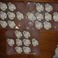 Baby Shower Cupcakes Yellow cupcakes with BC frosting; Penny's cookies with RI for head and feet.