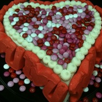 Happy Valentine's Day! Made this for my honey .... red velvet with cream cheese frosting (both recipes from this site). Wish the M&M's color matched the...