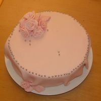 Pink Cake marble effect sponge (half light, half brown ), chocolate filling, gum paste roses and sugar pearls...