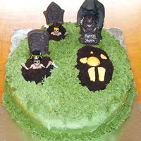 Loss Of Harry's Youth - Graveyard Over The Hill Cake Graveyard cake - Grim Reaper putting in the tombstone on the last fresh grave...Buttercream Icing over a standard Yellow Cake with...