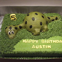 Dinosaur In Hiding Dinosaur Cake - Sept 2009Dino cake and bottom sheetcake is white cake, buttercream frosting...entire cake is cake - fondant for eyes only