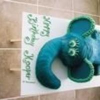 Elephant This is the largest cake I've ever done. A baby elephant lying on his belly with his cute curly tail in the back, little feet splayed...