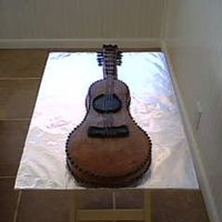 Life-Sized Guitar One of the largest cakes I've ever done. A near life-sized rendition of a guitar w/fondant accents. FUN STUFF!