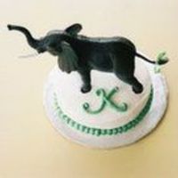 Mini Elephant Cake Very simple little baby cake to accompany the larger, main Mama Elephant cake. Adorned with a model elephant from a discount store.