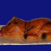 Roasted Pig Pig is carved from red velvet cake and iced with cream cheese frosting. I then airbrushed him various shades of brown, yellow and black and...