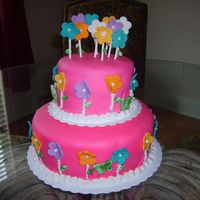 Tower Of Flowers This was a cake I made for my Princess Breanna. It is a 2 tier cake, 10 inch, and 6 inch with Homemade MMF.