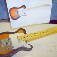 Fender Guitar vanilla cake exact replica of my boss's birthday present. he loved the cake AND his birthday present!! Almost didnt eat the cake!!...
