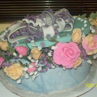 Gift Box Cake I am trying to remind myself this is only your forth cake, This cake did not turn out as planned, However I am very happy with the flowers...