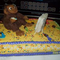 Monkey Painting THis is a crazy vanilla cake with cotton candy flavored icing, the Monkey is made out of Rice Krispies and covered in modeling chocolate....