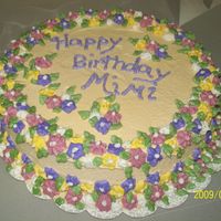 Mimi's Birthday This is a white chocolate almond sourcream cake with white chocolate buttercream and RI Flowers