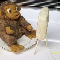 Painting Monkey this is a rice krispy moneky and easel covered in modeling chocolate