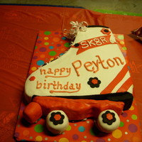 Skate Cake Carved skate shape & covered with icing & fondont accents. The wheels & bottom are cereal treats covered with fondont.