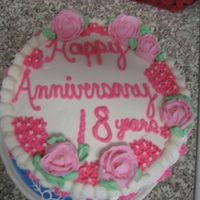 Mom And Dad's Anniversary Cake This is my first cake ever!!! It is a vanilla bean cake with cherry filling and wilton vanilla whipped cream icing. All the decorations and...