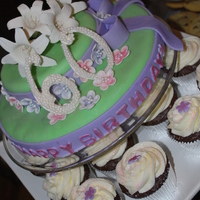 Mom's 60Th Birthday Cake Cake & matching cupcakes for my mom's 60th birthday. Gumpaste lillies & flowers, gumpaste "60" cake topper, and...