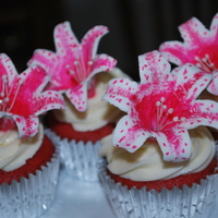 Stargazer Lilly Cupcakes Gumpaste startgazer lilies, painted with food coloring.