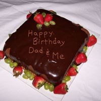 Scrumptious!! This idea was borrowed from another picture I found under the wedding cakes. It is a chocolate cake covered in chocolate buttercream and...