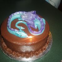Fire Breathing Dragon dragon is all fondant, i stuck a candle really far in, to get the fire breathing effect for the photo shot. Cake is chocolate chocolate...