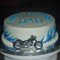 Blue Flames last minute birthday cake, buttercream with fondant flames. didnt have time to make motorcycle, so it is a scrapbook bike on a toothpic