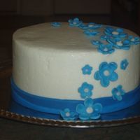 Blue Flowers buttercream with fondant ribbon and flowers 6"