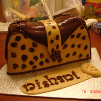 Animal Print Handbag Cake my first purse cake and first time carving a cake.made for a good friend who loves anything African - she loved it.