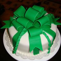 Green Present I made this for St. Patrick's Day, it's a white cake dyed green, covered in white fondant with green fondant bow and stripes. I...