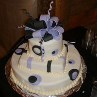 Black And Purple Polka Dot Cake I donated this cake to a non-profit org in NYC. It's a 14" round as the base, 8" square middle, and 6" round as the top...