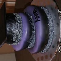 Purple, Silver, And Black Topsy Turvy! Topsy turvy cake made for a graduation student.