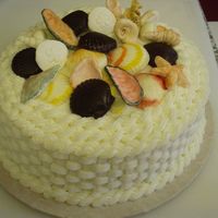 Dad's 80Th Birthday Seashell Cake Lemon buttercream basketweave on lemon cake. Some of the seashells are painted chocolate, others are painted gumpaste.