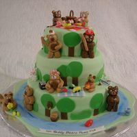 Teddy Bear's Picnic Three tier pound cake with vanilla frosting. Covered in Marshmallow Fondant... all decorations made with MMF. I made this cake for a county...